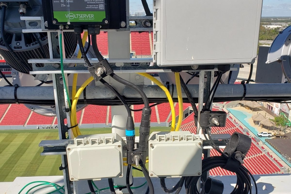 VoltServer digital electricity receiver and DAS equipment mounted above a stadium bowl